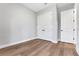 Bedroom featuring double door closet, light grey paint and wood-look floors at 14285 Crest Palm Ave, Windermere, FL 34786