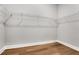 Walk-in closet with wire shelving and wood-look floors at 14285 Crest Palm Ave, Windermere, FL 34786