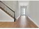 Bright foyer featuring hardwood floors, stairs to the left, and a chandelier at 14285 Crest Palm Ave, Windermere, FL 34786
