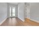 Bright Foyer featuring hardwood floors and a white front door at 14285 Crest Palm Ave, Windermere, FL 34786