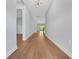 Open hallway featuring hardwood floors and light gray walls at 14285 Crest Palm Ave, Windermere, FL 34786