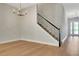 Stylish interior showcases a staircase and modern chandelier at 14285 Crest Palm Ave, Windermere, FL 34786