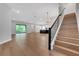 Open-concept living space with hardwood floors, leading to a modern kitchen at 14285 Crest Palm Ave, Windermere, FL 34786