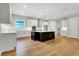Modern kitchen with white cabinets, black island, and stainless steel appliances at 14285 Crest Palm Ave, Windermere, FL 34786