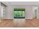 Open living space with wood floors and sliding glass doors to the outdoors at 14285 Crest Palm Ave, Windermere, FL 34786