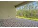 Covered patio with brick flooring, perfect for outdoor entertaining at 14285 Crest Palm Ave, Windermere, FL 34786