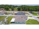 Aerial view of the property highlighting the backyard, white fence, and neighborhood setting at 15022 Se 94Th Ct, Summerfield, FL 34491
