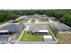 The aerial view captures the well-kept backyard with a shed and screened-in patio at 15022 Se 94Th Ct, Summerfield, FL 34491