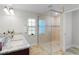 Bathroom featuring a glass-enclosed shower, double sink vanity, and modern finishes at 15022 Se 94Th Ct, Summerfield, FL 34491