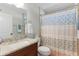 Charming bathroom features granite countertops, a sink, and a toilet at 15022 Se 94Th Ct, Summerfield, FL 34491