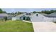 A nicely landscaped single-Gathering home with a well-maintained lawn and long driveway leading to a two-car garage at 15022 Se 94Th Ct, Summerfield, FL 34491