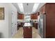 Bright kitchen with a center island, stainless steel appliances, skylights, and ample cabinet space at 15022 Se 94Th Ct, Summerfield, FL 34491