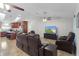 A bright and airy living space with tile flooring, vaulted ceilings and an open layout, connecting the kitchen at 15022 Se 94Th Ct, Summerfield, FL 34491