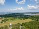 An aerial view showcasing the community's lakefront location, green spaces, and scenic views at 16951 Florence View Dr, Montverde, FL 34756