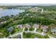 An aerial view of neighborhood homes near the lake, sports fields, and a water tower at 16951 Florence View Dr, Montverde, FL 34756
