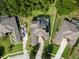Aerial view showing home with screened pool and meticulously manicured landscaping at 16951 Florence View Dr, Montverde, FL 34756