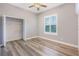 This bedroom has ample natural light from the window and a spacious closet for storage at 16951 Florence View Dr, Montverde, FL 34756
