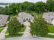 Beautiful home featuring lush landscaping, a brick driveway, and a screened-in lanai at 16951 Florence View Dr, Montverde, FL 34756