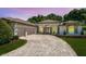 Beautiful single-Gathering home with well-manicured landscaping and an elegant circular driveway at 16951 Florence View Dr, Montverde, FL 34756