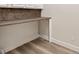 Laundry room featuring a countertop with a white base and natural stained wood upper at 16951 Florence View Dr, Montverde, FL 34756