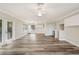 Open-concept living room featuring wood-look flooring, natural light, and sleek design elements at 16951 Florence View Dr, Montverde, FL 34756