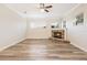 Bright living room featuring a stone fireplace, and large windows at 16951 Florence View Dr, Montverde, FL 34756