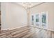 Spacious living room with high ceilings, vinyl flooring, and sliding glass doors to the lanai at 16951 Florence View Dr, Montverde, FL 34756