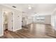 Open-concept space with wood-look flooring, plenty of natural light, and doorway to an ensuite bathroom at 16951 Florence View Dr, Montverde, FL 34756