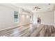 Main bedroom with hardwood flooring, neutral color palette, and view of ensuite bath at 16951 Florence View Dr, Montverde, FL 34756