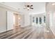 Large main bedroom suite with hardwood flooring and french doors to the outdoor pool at 16951 Florence View Dr, Montverde, FL 34756