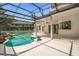 A gorgeous screened-in pool with landscaping and a large patio perfect for entertaining at 16951 Florence View Dr, Montverde, FL 34756