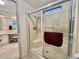 Shower room includes a glass door and bright small window at 175 Hibiscus Way, Leesburg, FL 34748