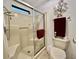 Walk in shower features glass door and towel rack at 175 Hibiscus Way, Leesburg, FL 34748