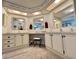 Bathroom features dual sinks, ample lighting, and a vanity area at 175 Hibiscus Way, Leesburg, FL 34748