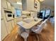 Bright kitchen with a large island, modern appliances, and ample cabinet space at 175 Hibiscus Way, Leesburg, FL 34748