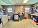 Utility room featuring washer, dryer, shelving and storage options at 175 Hibiscus Way, Leesburg, FL 34748