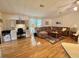 A cozy living room features a plush sofa, wooden coffee table, and built in desk at 175 Hibiscus Way, Leesburg, FL 34748