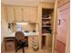 Bright office space featuring built-in desk, cabinets, and storage for efficient home management at 175 Hibiscus Way, Leesburg, FL 34748