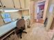 Small office space featuring a built-in desk and shelving at 175 Hibiscus Way, Leesburg, FL 34748