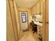 Compact office space with built-in desk and storage at 175 Hibiscus Way, Leesburg, FL 34748