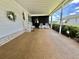Relaxing porch area with seating, steps to the front door, and a decorated wreath at 175 Hibiscus Way, Leesburg, FL 34748