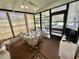 Cozy sunroom with abundant natural light and space for dining at 175 Hibiscus Way, Leesburg, FL 34748