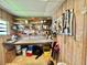 Functional workshop space with ample shelving, a work surface, and tool storage at 175 Hibiscus Way, Leesburg, FL 34748