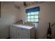 Practical laundry room featuring washer, dryer, and window with natural light, with space for storage at 18015 Palm St, Umatilla, FL 32784