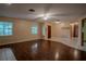 Spacious living room with a ceiling fan and two windows providing ample natural light at 18015 Palm St, Umatilla, FL 32784