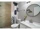Renovated bathroom features modern vanity, stylish mirror and shower with decorative curtain at 1805 Jefferson Dr, Mount Dora, FL 32757