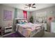 bedroom with colorful decor, a mermaid blanket, and playful unicorn decor at 1805 Jefferson Dr, Mount Dora, FL 32757
