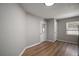 The room offers natural light, neutral walls, and wood-look flooring at 1805 Jefferson Dr, Mount Dora, FL 32757