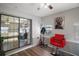 Multipurpose room with sliding glass doors, professional styling chair, and modern decor at 1805 Jefferson Dr, Mount Dora, FL 32757