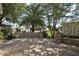 Beautiful backyard with paver patio, custom stone benches, and lush tropical landscaping at 2003 Cordero Ct, The Villages, FL 32159